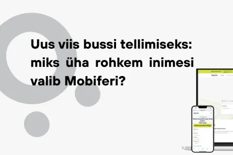 Sülearvutis ja telefonis avatud veebiplatvorm hallil taustal.